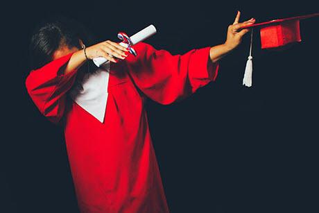 Woman in red graduation gown