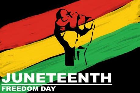 Juneteenth Freedom Day. Silhouette of a fist over red, yellow, and green stripes.